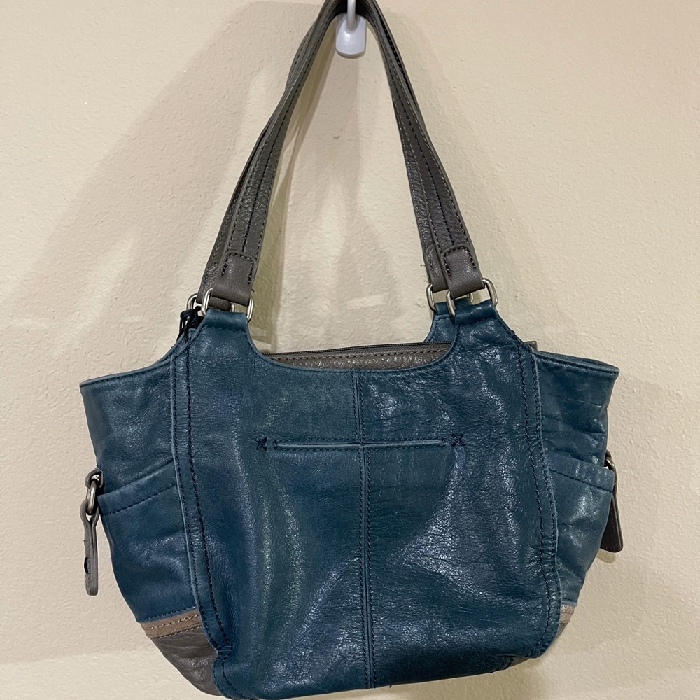 The SAK warm navy in color purse NWT